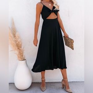 Cut-out midi dress. Never worn. Size M.